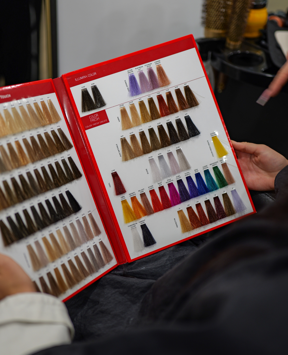 image of colour palette customer is holding in her arms in best hair salon in Sheffield